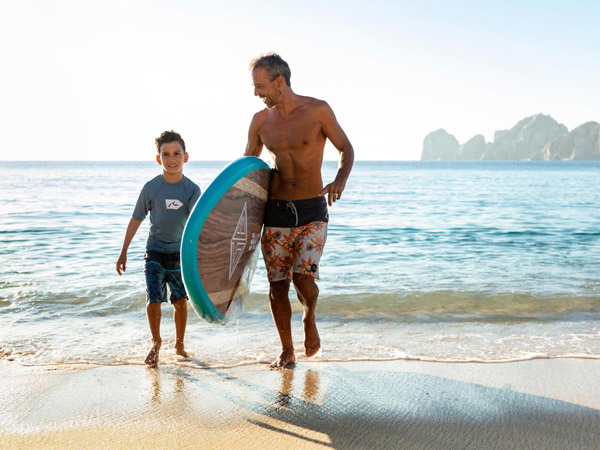 Dad And Son With A Paddleboard.