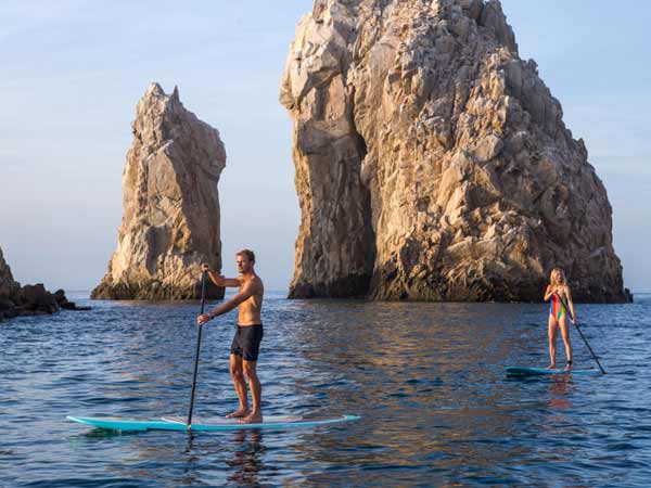 Father And Daughter Paddleboarding.