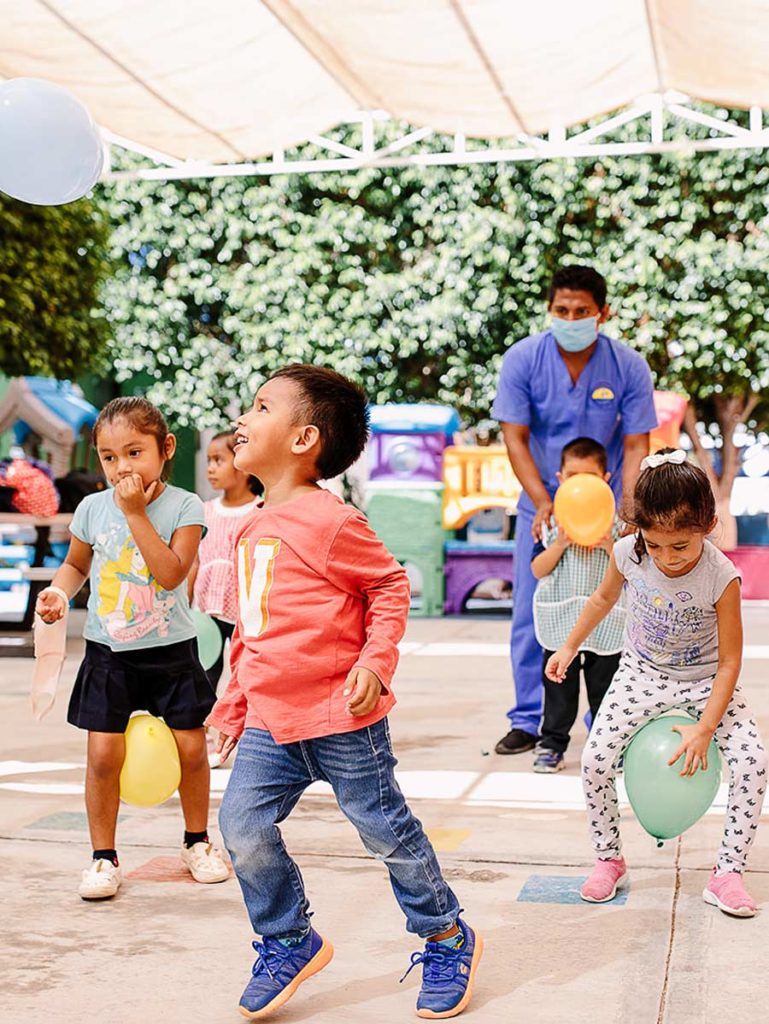 Children Playing With Baloons.