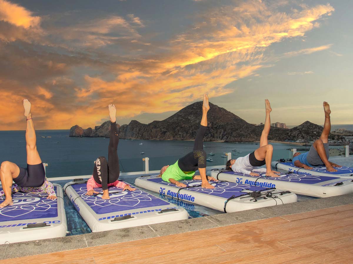 yoga on rooftop at sunset