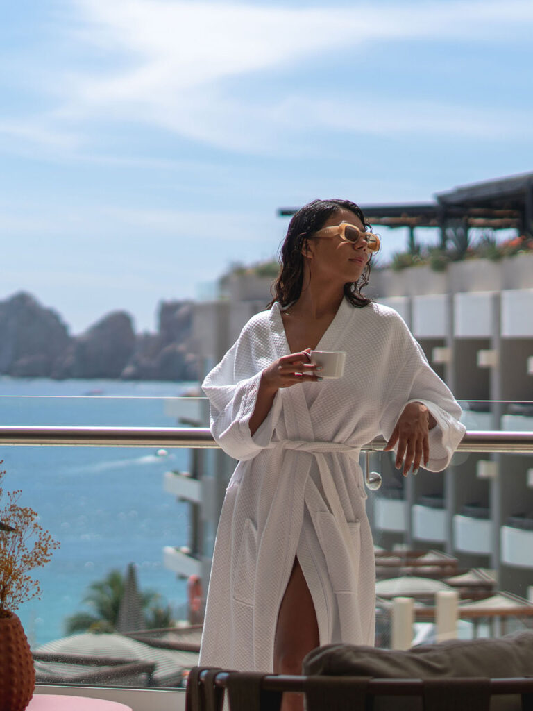 Lady Drinking Coffee In A Bathrobe.