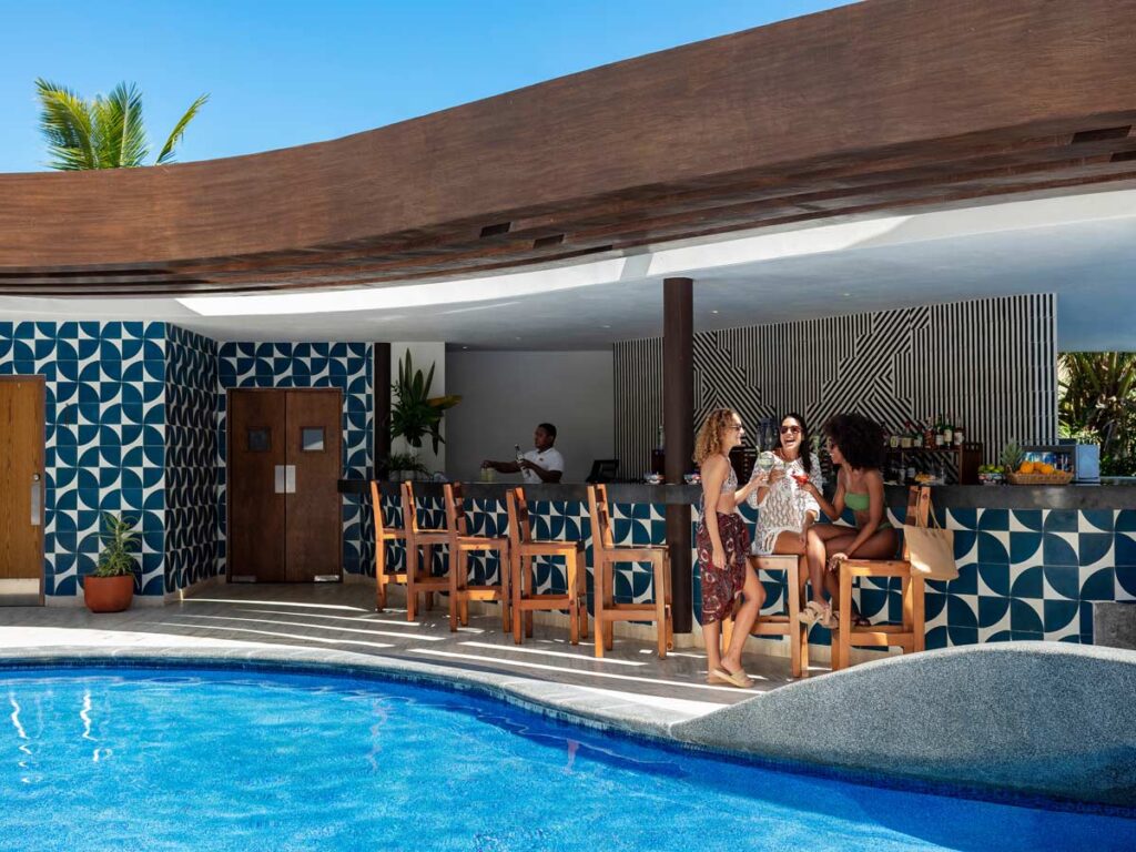 Ladies Having Drinks By The Pool.