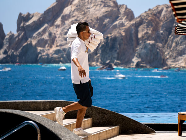 Pool Attendant Carrying Towels